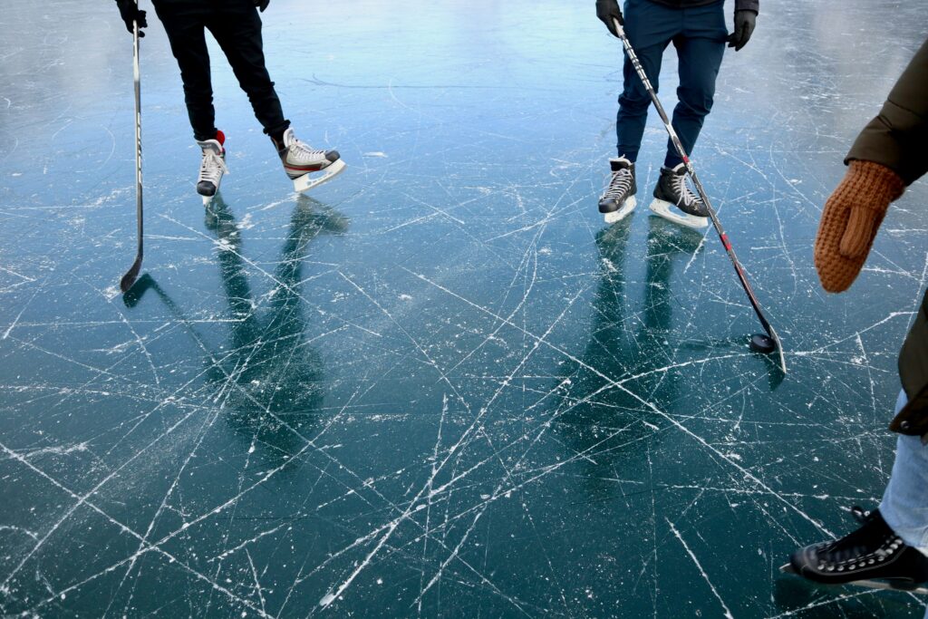 Photo by <a href="https://unsplash.com/@isiparente?utm_source=unsplash&utm_medium=referral&utm_content=creditCopyText">Isi Parente</a> on <a href="https://unsplash.com/photos/three-persons-playing-ice-hockey-sLMqgNQJx18?utm_source=unsplash&utm_medium=referral&utm_content=creditCopyText">Unsplash</a>